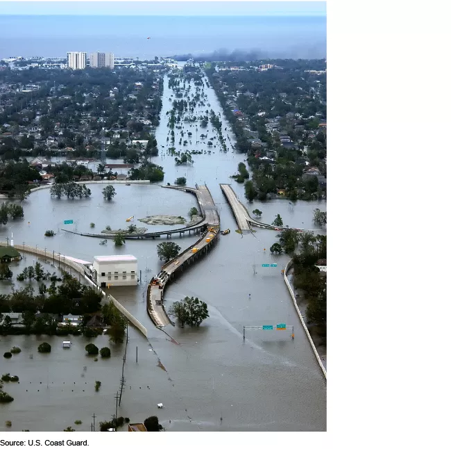Photo showing flooding in New Orleans after Hurricane Katrina in August 2005. Most of the interstate is underwater, as well as the lower area in of homes and building in the photo.